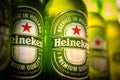 Marinette,WI / U.S.A. - Aug16,2019: Cold bottles of Heineken Beer with drops over green background. Heineken is the flagship produ Royalty Free Stock Photo