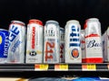 Marinette,WI/USA- Nov9,2019: An assortment of domestic and imported beers on white. Brands include, Coors, Budweiser, Corona, Bas