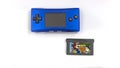 Mario vs Donkey Kong game from 2004 and a blue Game Boy Micro, smallest handheld video game console from Nintendo