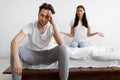 Married Couple Having Quarrel, Sitting In Bedroom At Home Royalty Free Stock Photo