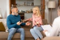 Unhappy Mature Couple Having Quarrel During Marital Therapy Session Indoors Royalty Free Stock Photo