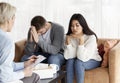 Unhappy Couple Sitting In Family Psychologist`s Office, Selective Focus