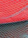 Maritime background Red ship blue fish net and dark Sea Royalty Free Stock Photo