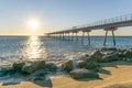 Maritime bridge at sunrise with rocks