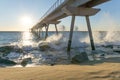 Maritime bridge at sunrise with rocks