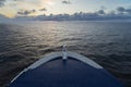 Maritime logistics. The bow of a cruise ship on the open sea with a view of the horizon after sunset Royalty Free Stock Photo