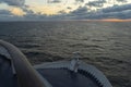 Maritime logistics. The bow of a cruise ship on the open sea with a view of the horizon after sunset. Wide angle lens Royalty Free Stock Photo