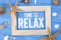 Maritime decoartion with chalkboard and frame showing the message Time to Relax Royalty Free Stock Photo