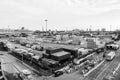 Maritime port or terminal with cargo container stacks, trucks on cloudy sky. Shipping, deliver, loading, warehouse Royalty Free Stock Photo