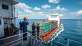 Maritime Professionals on Deck Overseeing Cargo Ship Royalty Free Stock Photo
