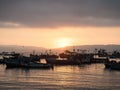 Maritime sunset seascape of traditional typical fishing boat ships Paracas harbor port pacific ocean Peru South America
