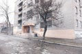 Mariupol, Ukraine - March 5, 2022: Men warm up and prepare food on bonfire outside hotel Nautical under bombardment