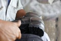 Repairing broken shoes by a shoe repairman Royalty Free Stock Photo