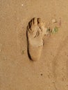 Male footprint on the sea Royalty Free Stock Photo