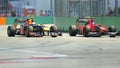 Mark Webber overtaking Charles Pic at F1 Singapore Royalty Free Stock Photo