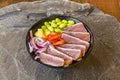 Marked on the Iron Bluefin Tuna Tataki Bowl with Edamame, Chopped Red Pepper and Red Onion