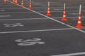 Car parking lot with white mark and traffic cone on street used warning sign on road. Traffic Cones as a road Safety sign Royalty Free Stock Photo