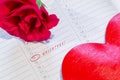 Marked the Valentine`s day on calendar with rose and heart Royalty Free Stock Photo