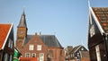 Marken, a fishing village with traditional wooden houses and the church Grote Kerk, located in the North of Amsterdam Royalty Free Stock Photo