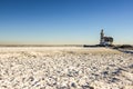 The lighthouse of Marken, `het Paard van Marken` in winter and the frozen Markermeer, Holland