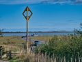 The marker at the causeway to Holy Island Lindisfarne in Northumberland, England, UK. Royalty Free Stock Photo