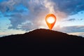 Marker navigation point on top of the mountain, sunset sky with sun collage