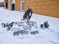 The marker sculpture composition of two flea dogs on the Lousy hill in winter. Nizhny Tagil. Russia