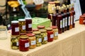 Market. Autumn seasonal pickled or fermented colorful vegetables in glass jars placed Royalty Free Stock Photo