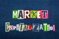 MARKET CAPITALIZATION text word collage, multi colored fabric on blue denim, market value concept
