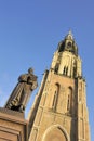 Market in Delft with old statue of Hugo de Groot