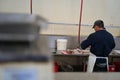 Market Employee Cleaning Fresh Fish