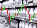 Market graph on blur image of supermarket background. Defocused shelves with dairy products. Grocery store. Retail industry. Rack