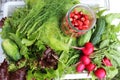 Market. Healthy vegan food. Fresh vegetables, berries, greens and fruits in a white tray: dill, strawberries, cucumbers, radishes Royalty Free Stock Photo