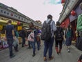 Market in Japan full of different people, west-east, big-small,