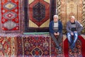 Armenian men sit and relax on the carpets at the Vernissage Market in Yerevan, Armenia. Royalty Free Stock Photo