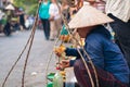 Market lady counting money on the street