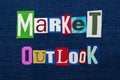 MARKET OUTLOOK text word collage, multi colored fabric on blue denim, future market direction concept