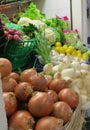 Market place in Torrevieja, Spain, with onion, garlic, radish, mushrooms, lemons, cauliflowers, and lettuse for sale