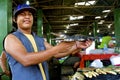 Market seller, Peruvian Amazon with Crocodile