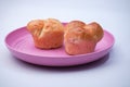 Market snack bread filled with jam on a white background