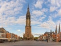 Market square of Delft with a view of majestic tower of Nieuwe Kerk church Royalty Free Stock Photo