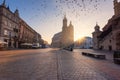 Krakow old town, Market square with St. Mary`s church at sunrise, historical center cityscape, Poland, Europe Royalty Free Stock Photo