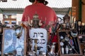 Market stall catering to tourists, selling Judaica and vintage items of Jewish interest, in Plac Nowy, Kazimierz, Krakow Poland