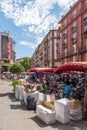 Market stall with sellers and customers during the Grande Braderie street fair