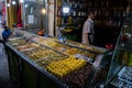Market stall selling pickled olives preserved in olive oil, in Fes el Bali, in city of Fez, Morocco