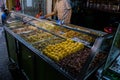 Market stall selling pickled olives preserved in olive oil, in Fes el Bali, in city of Fez, Morocco