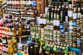 Market stall selling preserved truffles, olive oil, cheese and honey in mason jars and bottles Royalty Free Stock Photo