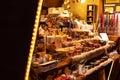 Market stall showing an assortment of handmade candles from spices at traditional famous christmas market at Merano