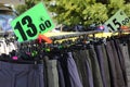 Market stall with summer clothing for sale and price 13 in the label