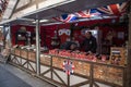 Market stall vendor selling British Cheeses on the street